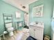 Bathroom with a toilet, shower, and a white vanity with a mirror at 9427 E University Dr # 100, Mesa, AZ 85207