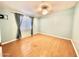 Spacious bedroom with light blue walls and laminate flooring at 9427 E University Dr # 100, Mesa, AZ 85207