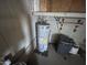 Unfinished garage interior with water heater at 9427 E University Dr # 100, Mesa, AZ 85207