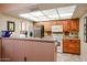 Well-equipped kitchen with ample cabinetry and a breakfast bar at 13636 W Aleppo Dr, Sun City West, AZ 85375