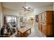 Living room features a vaulted ceiling, tiled floors, and comfortable seating at 13636 W Aleppo Dr, Sun City West, AZ 85375