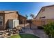 Backyard with a storage shed and access gate at 20362 E Bronco Dr, Queen Creek, AZ 85142