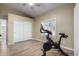 Home gym with Peloton exercise bike and mirrored closet doors at 20362 E Bronco Dr, Queen Creek, AZ 85142