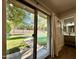 View of a refreshing backyard pool through sliding glass doors at 4442 E Aire Libre Ave, Phoenix, AZ 85032