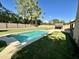 Inviting backyard pool with grassy area at 4442 E Aire Libre Ave, Phoenix, AZ 85032