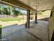 Spacious backyard with covered patio and grassy area at 4442 E Aire Libre Ave, Phoenix, AZ 85032