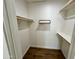 Large walk-in closet with double hanging rods and shelving at 4442 E Aire Libre Ave, Phoenix, AZ 85032