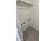 Closet with single hanging rod and tile flooring at 14406 N Cameo Way, Sun City, AZ 85351