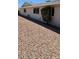 Ranch style home with gravel landscaping and mature shrubbery at 14406 N Cameo Way, Sun City, AZ 85351