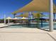 Resort-style pool with shade structures and water features at 15922 W Electra Ln, Surprise, AZ 85379