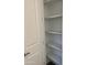 Well-lit pantry with ample shelving for storage at 15922 W Electra Ln, Surprise, AZ 85379