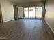 Spacious living area with sliding glass doors leading to backyard at 15922 W Electra Ln, Surprise, AZ 85379