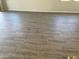 Gray wood-look tile flooring throughout the home at 15922 W Electra Ln, Surprise, AZ 85379