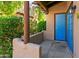Spanish-style building exterior with lush landscaping and a courtyard at 1446 E Grovers Ave # 26, Phoenix, AZ 85022