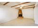 Living room featuring a fireplace and wood beams at 1446 E Grovers Ave # 26, Phoenix, AZ 85022