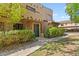 Spanish-style condo building with walkway and landscaping at 1446 E Grovers Ave # 26, Phoenix, AZ 85022