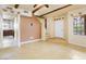 Living room with tiled floors and exposed beams at 1446 E Grovers Ave # 26, Phoenix, AZ 85022