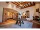 Elegant lobby with fireplace and rustic wooden beams at 8710 E Lost Gold Cir, Gold Canyon, AZ 85118