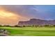 Picturesque golf course with mountain views and sunset lighting at 8710 E Lost Gold Cir, Gold Canyon, AZ 85118