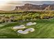 Aerial view of golf course with sand traps and mountain backdrop at 8710 E Lost Gold Cir, Gold Canyon, AZ 85118