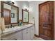 Double vanity bathroom with granite countertops and large mirrors at 8710 E Lost Gold Cir, Gold Canyon, AZ 85118