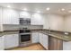 Modern kitchen with stainless steel appliances and granite countertops at 21320 N 56Th St # 2159, Phoenix, AZ 85054