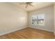 Light and airy bedroom featuring wood flooring and window shutters at 21320 N 56Th St # 2159, Phoenix, AZ 85054