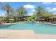 Community pool with palm trees and lounge chairs at 21320 N 56Th St # 2159, Phoenix, AZ 85054
