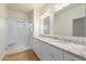 Bathroom with double vanity, granite countertop and glass shower at 21320 N 56Th St # 2159, Phoenix, AZ 85054