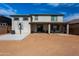 Home exterior and backyard with patio and basketball hoop at 17663 W Straight Arrow Ln, Surprise, AZ 85387