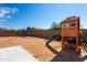 Large backyard with playset and trampoline at 17663 W Straight Arrow Ln, Surprise, AZ 85387