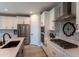 Modern kitchen with island, stainless steel appliances, and breakfast bar at 17663 W Straight Arrow Ln, Surprise, AZ 85387