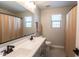 Modern bathroom with double vanity and walk-in shower at 17663 W Straight Arrow Ln, Surprise, AZ 85387