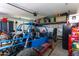 Garage with shelving, toolboxes and a dune buggy at 17663 W Straight Arrow Ln, Surprise, AZ 85387
