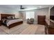 Spacious main bedroom with a large bed and sitting area at 17663 W Straight Arrow Ln, Surprise, AZ 85387