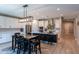 Modern kitchen with island, stainless steel appliances, and breakfast bar at 17663 W Straight Arrow Ln, Surprise, AZ 85387