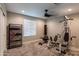Bright home gym with weight machine, punching bag, and storage at 17663 W Straight Arrow Ln, Surprise, AZ 85387