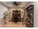 Home office with a large desk, shelving, and comfortable chair at 17663 W Straight Arrow Ln, Surprise, AZ 85387