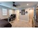 Cozy bedroom with built-in desk and en-suite bathroom access at 17663 W Straight Arrow Ln, Surprise, AZ 85387