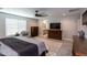 Main bedroom with large bed, dresser, and ensuite bath at 17663 W Straight Arrow Ln, Surprise, AZ 85387
