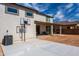 Home exterior and backyard with basketball hoop and patio at 17663 W Straight Arrow Ln, Surprise, AZ 85387