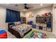 bedroom with playful decor and ample storage at 17663 W Straight Arrow Ln, Surprise, AZ 85387