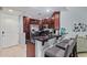 Updated kitchen featuring a breakfast bar and stainless steel refrigerator at 5450 E Deer Valley Dr # 2012, Phoenix, AZ 85054