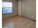 Bright bedroom with wood flooring, window, and neutral walls at 11596 W Sierra Dawn Blvd # 28, Surprise, AZ 85378