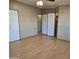 Large bedroom with laminate flooring and double door closets at 11596 W Sierra Dawn Blvd # 28, Surprise, AZ 85378