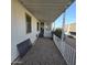 Mobile home with covered patio, gravel yard, and partial view of neighborhood at 11596 W Sierra Dawn Blvd # 28, Surprise, AZ 85378