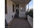Mobile home with covered patio, gravel yard, and partial view of neighborhood at 11596 W Sierra Dawn Blvd # 28, Surprise, AZ 85378