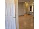 Bright entryway with light wood laminate flooring, leading to the main living area at 11596 W Sierra Dawn Blvd # 28, Surprise, AZ 85378