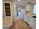 Kitchen features a breakfast bar, laundry access, and white appliances at 11596 W Sierra Dawn Blvd # 28, Surprise, AZ 85378