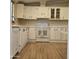 Kitchen with white cabinets and double sink at 11596 W Sierra Dawn Blvd # 28, Surprise, AZ 85378